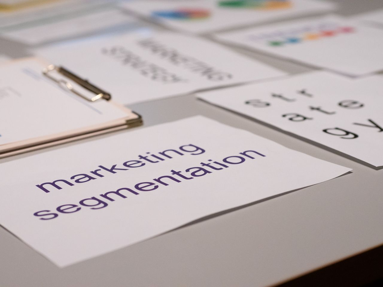 services-04 Close-up of various marketing documents on a desk, perfect for business and strategy discussions.